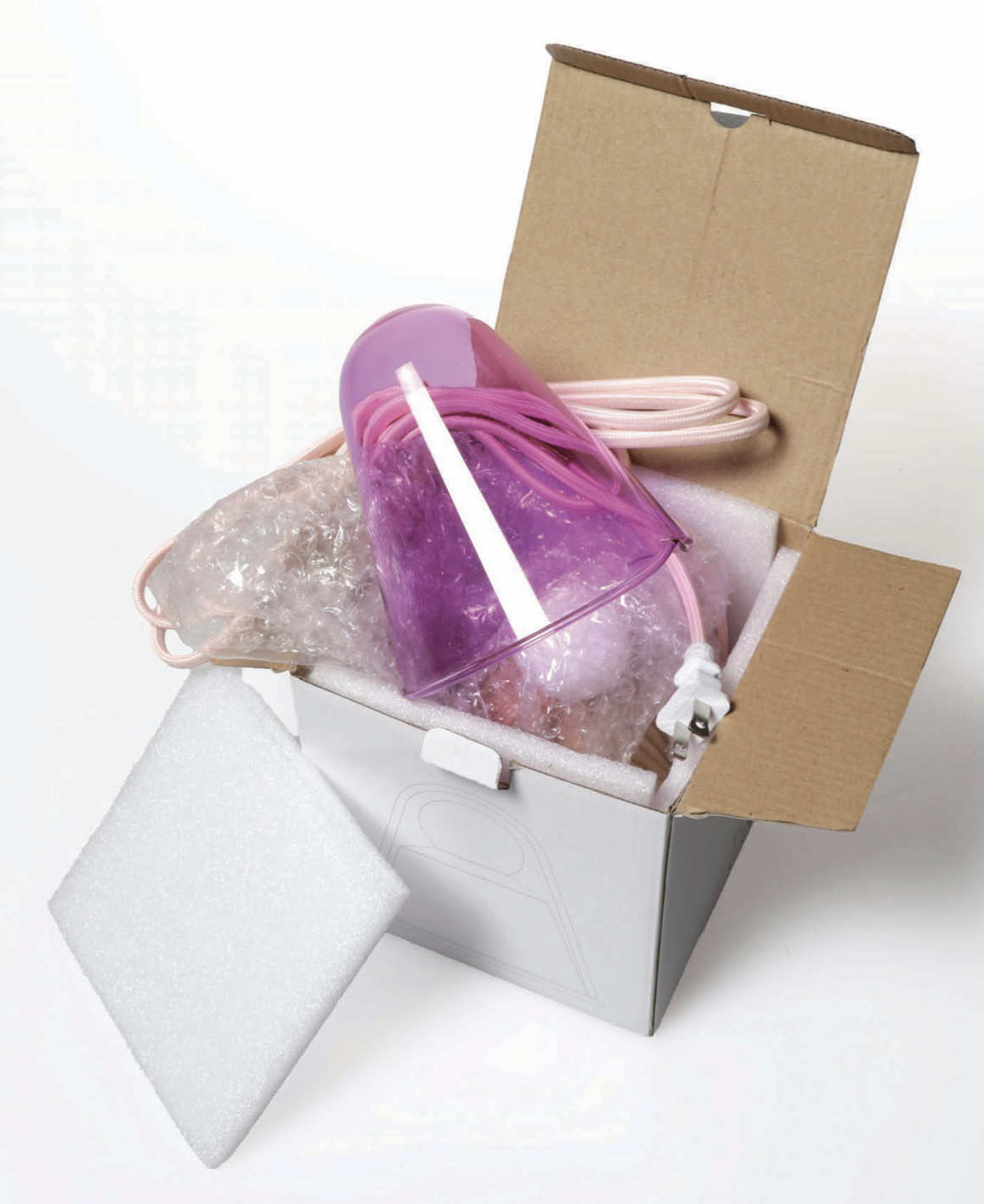 Packaging — lamp packed in box with foam