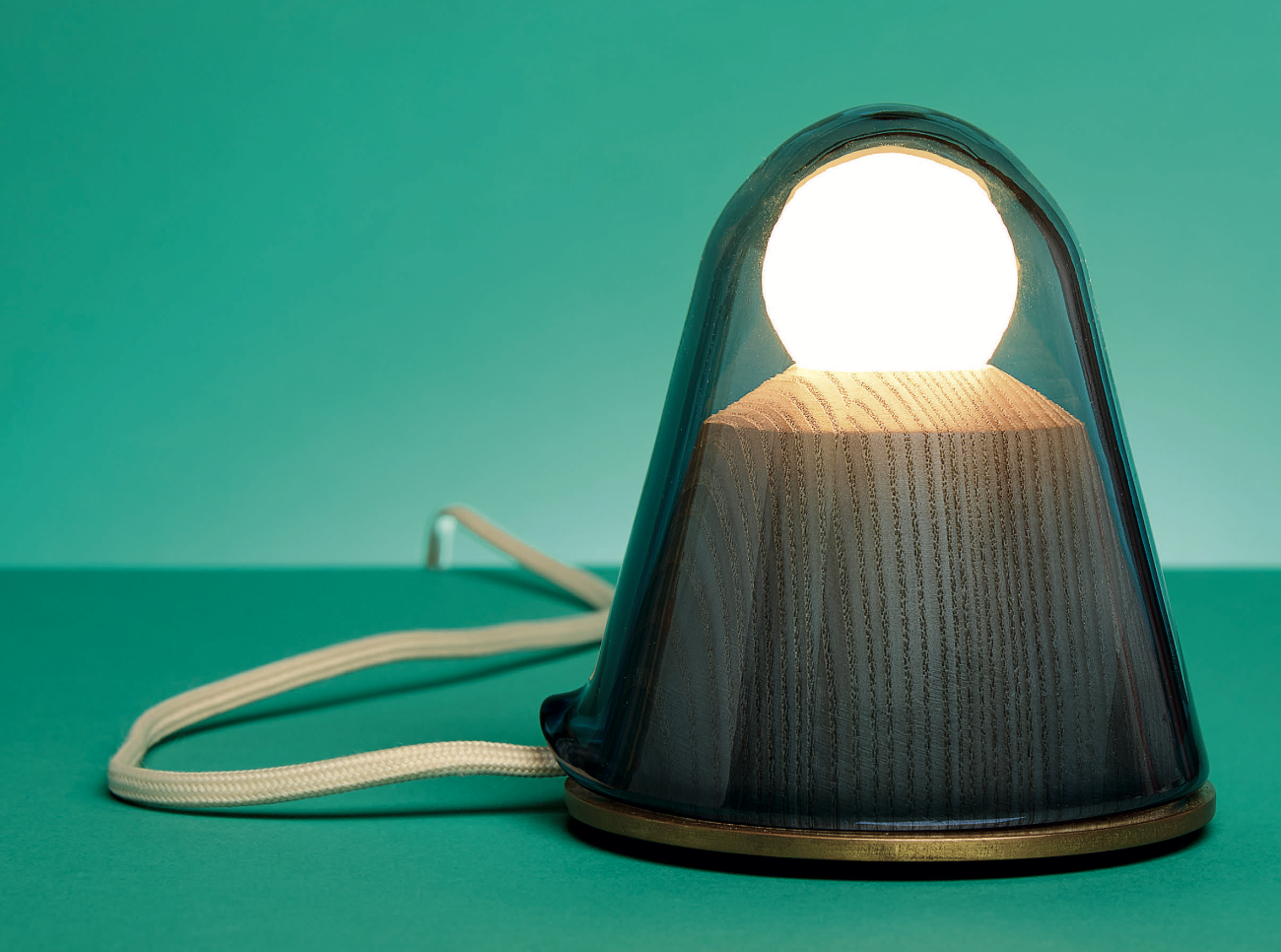 Handmade prototype — glowing on green background