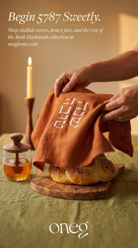 Ad: hands placing the challah cover, Begin 5787 Sweetly.