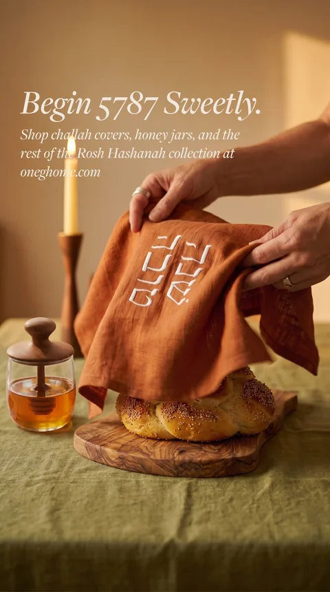 Ad: hands placing the challah cover, a second variation.