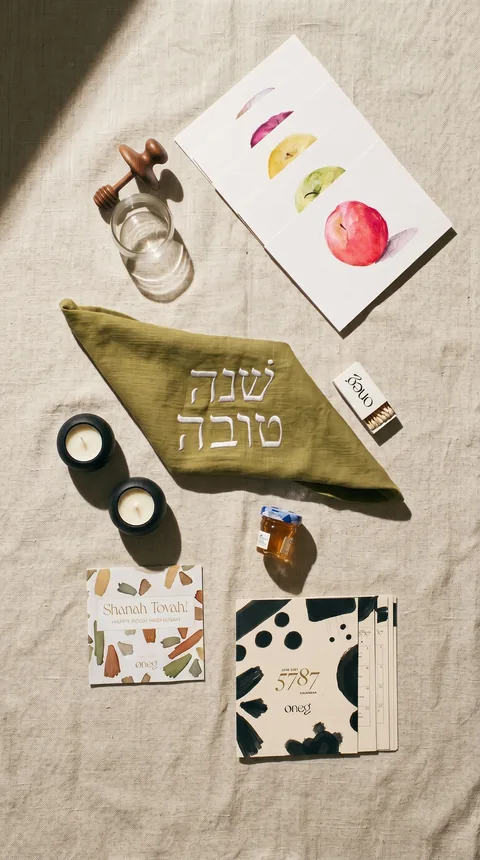 Ad: the Celebrate Box laid flat on linen.
