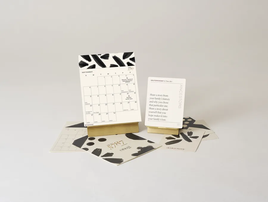 The 5787 calendar on its brass stand with conversation cards.